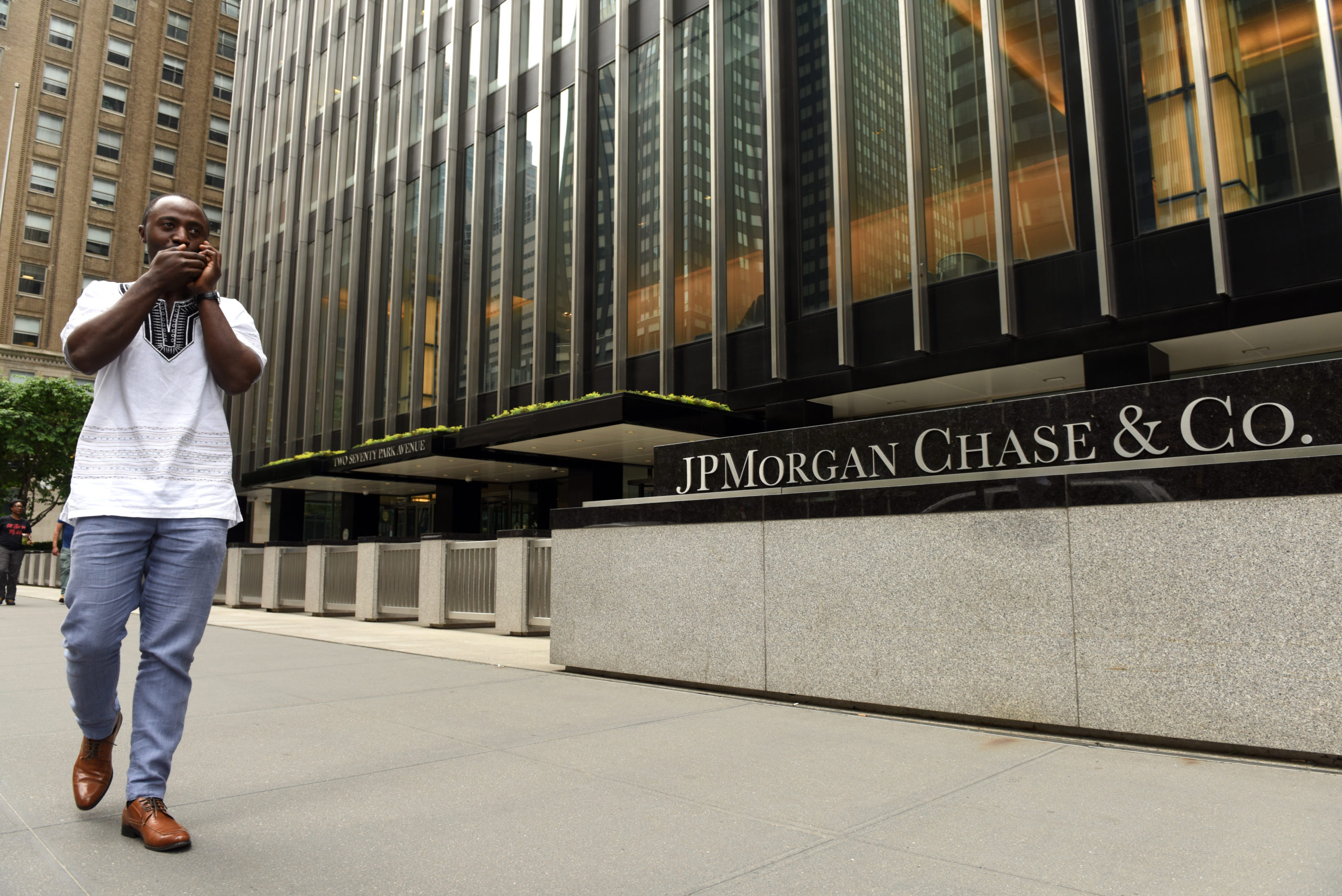 a man walks past jp morgan chase office scaled 1 FTX CEO Bankman-Fried is okay with being called the ‘JP Morgan of crypto’