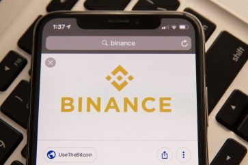 binance logo mobile phone scaled 1 Binance to halt support for USDC as a tradable asset