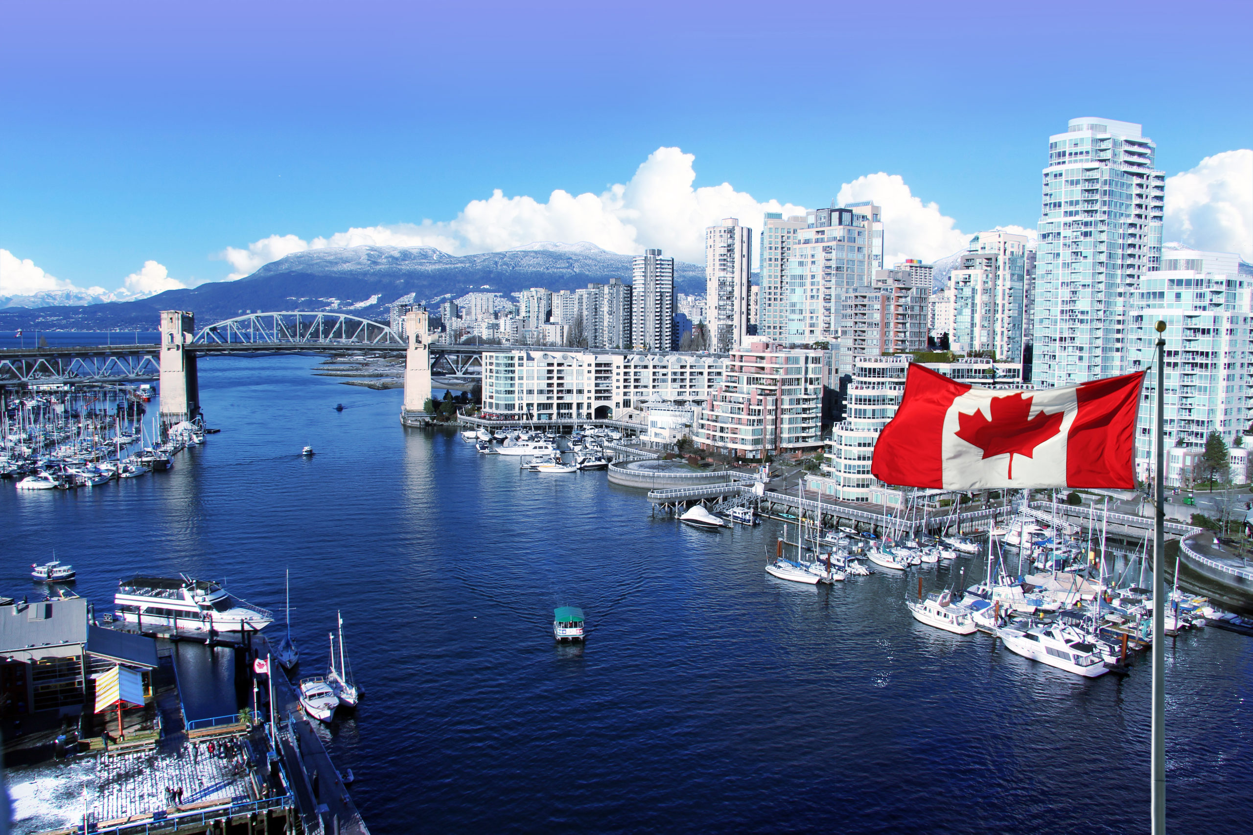 canada flag city skyline scaled 1 Binance Canada partners with MinervaAI to boost compliance effort