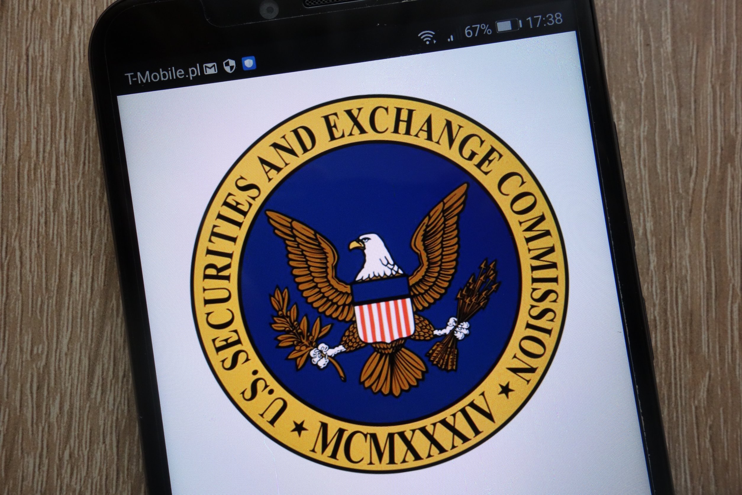 sec logo on smartphone SEC sues crypto influencer Ian Balina