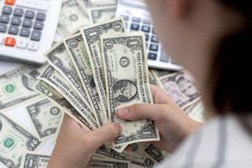Dollar held near three-month high